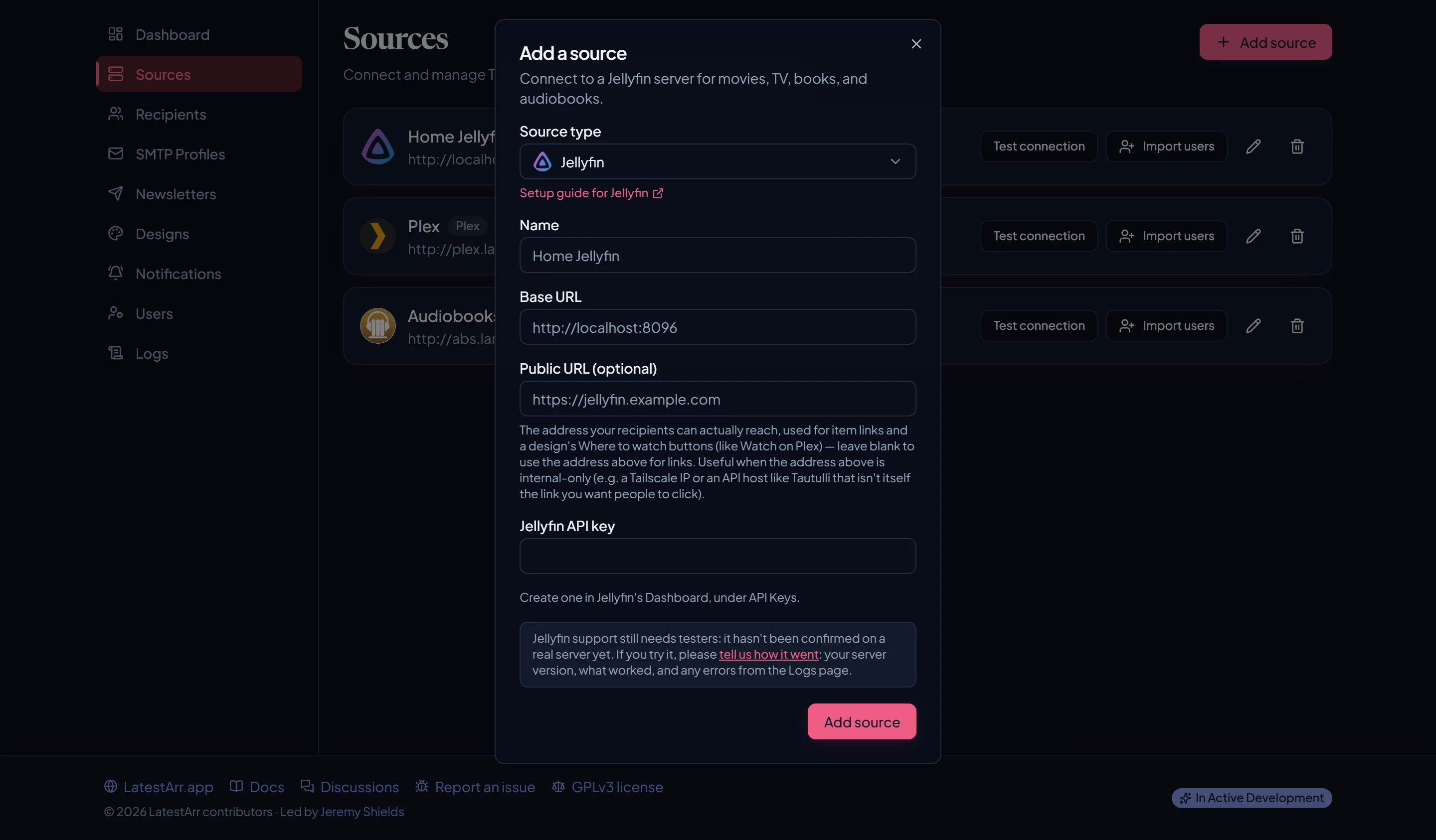The Add source dialog with Jellyfin selected, showing the API key hint and the needs-testers note